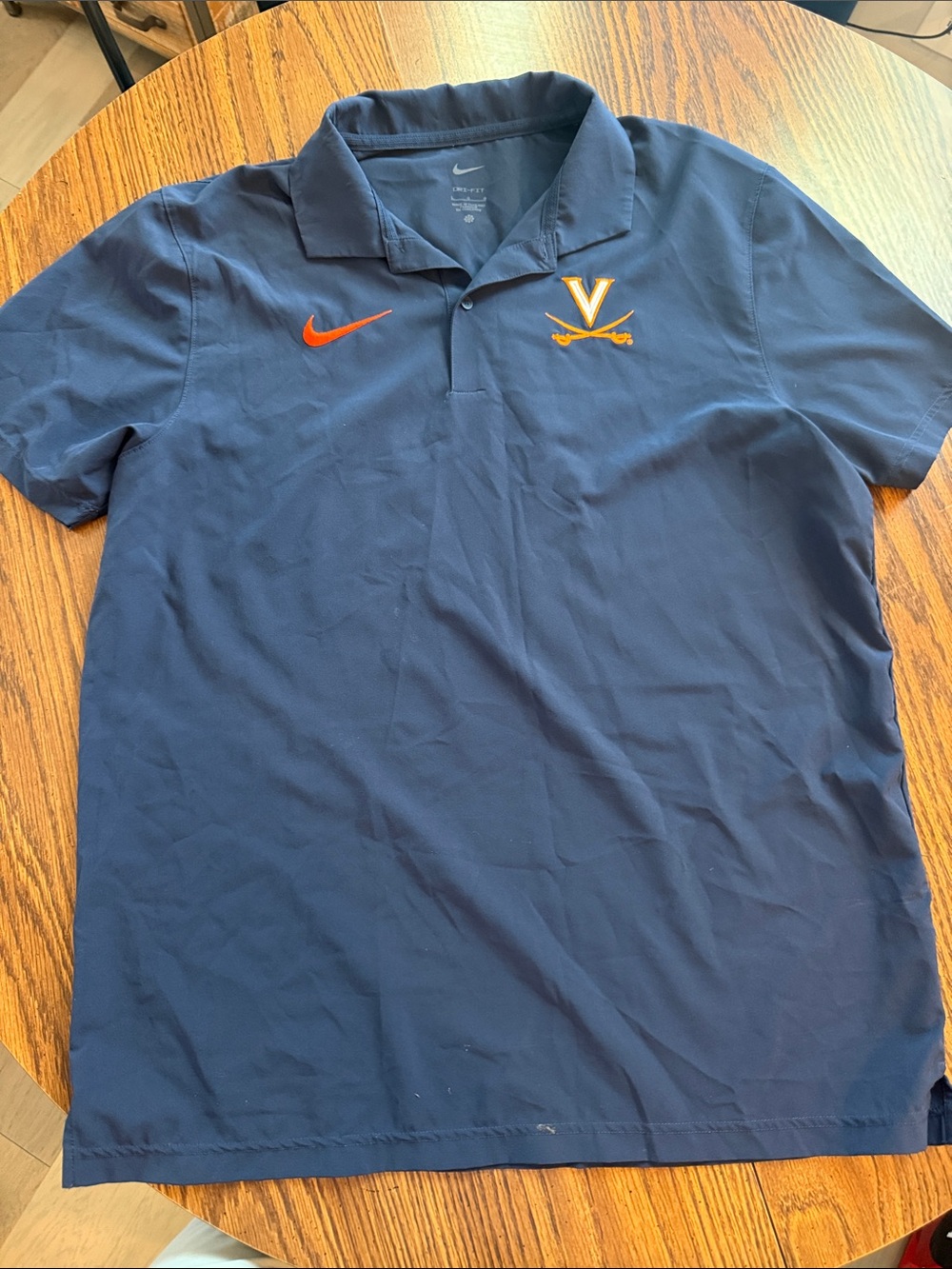 Nike Men’s Dri-fit Navy Polo with Orange Embroidered 'V' and Swoosh. UVA logo.